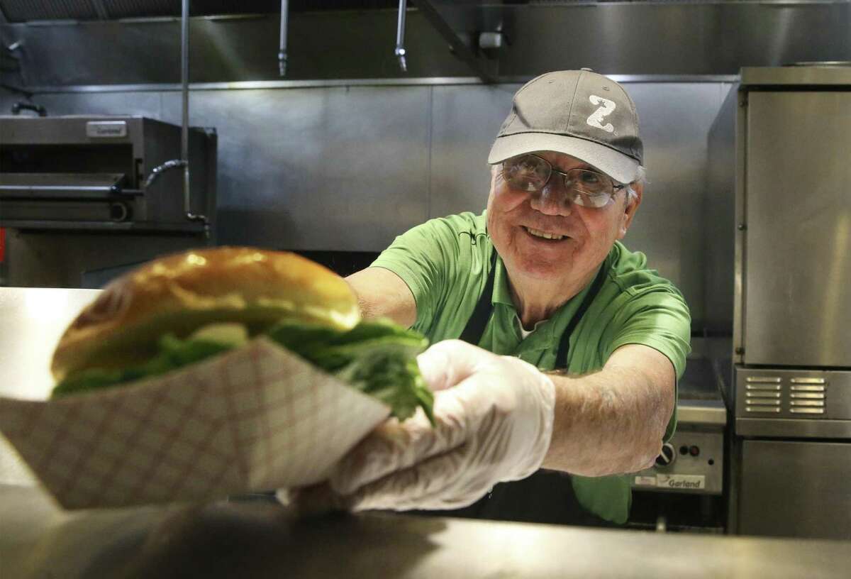 John Godoy works his food prep job at the San Antonio Zoo's Beastro Restaurant on December 6, 2018.