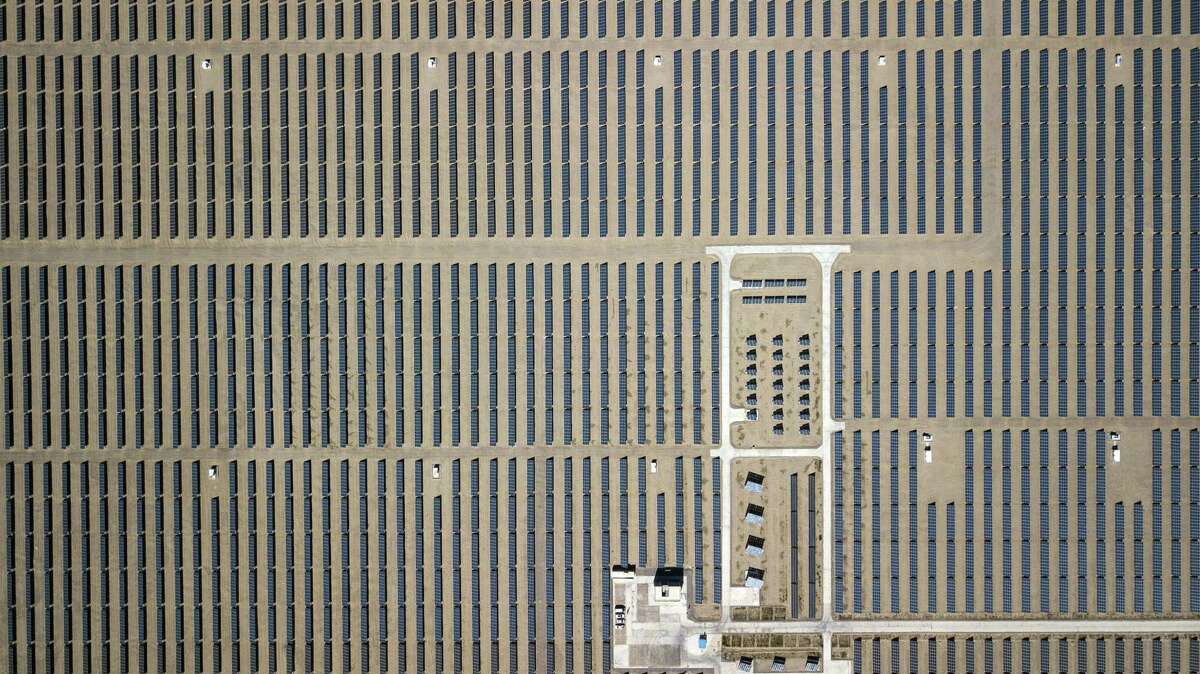 Photovoltaic panels stand at a solar power station operated by Huanghe Hydropower Development Co., a unit of State Power Investment Corp., at the Golmud Solar Park in this aerial photograph taken on the outskirts of Golmud, Qinghai province, China, on July 24, 2018. MUST CREDIT: Qilai Shen/Bloomberg