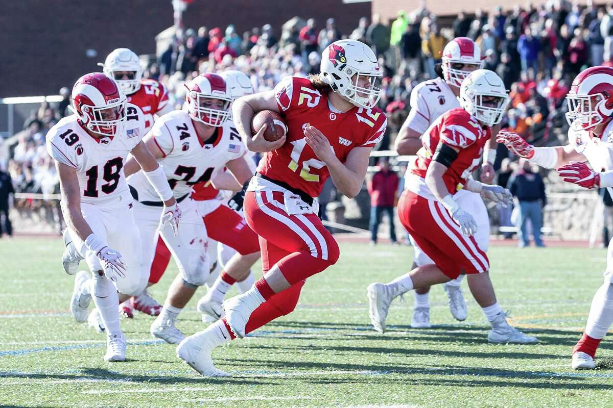Gavin Muir (12) of Greenwich runs in a touchdown during the Class LL state championship game between on New Canaan and Greenwich on December 8, 2018 at Stamford High School in Stamford, CT.