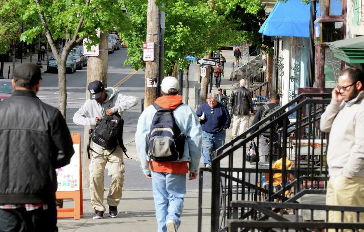 People traverse the Lark Street sidewalks, Monday afternoon May, 13, 2013, in Albany, N.Y. (Will Waldron/Times Union)