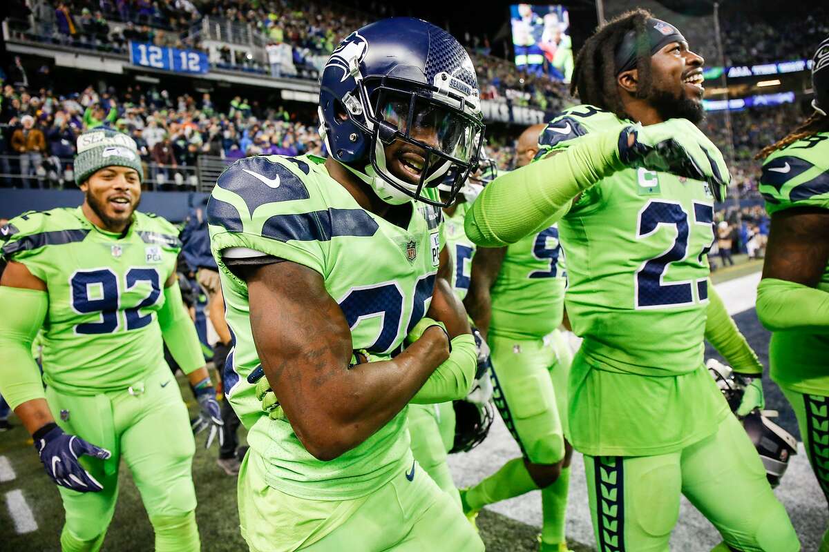 SEATTLE, WA - DECEMBER 10: Justin Coleman #28 of the Seattle Seahawks celebrates his fumble recovery for a touchdown with Neiko Thorpe #23 and Nazir Jones #92 in the fourth quarter against the Minnesota Vikings at CenturyLink Field on December 10, 2018 in Seattle, Washington. (Photo by Otto Greule Jr/Getty Images)