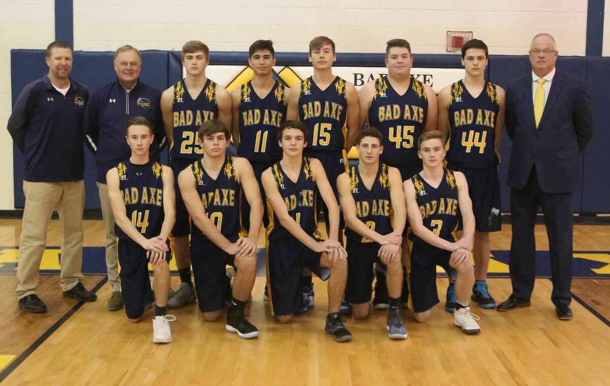 Members of the Bad Axe boys varsity basketball team are (front row from left) James Kervin, Jack Clancy, Ethan Kent, Spencer Britt and Aaron Sowles (back row) assistant coach Jason Jurgess, assistant coach Pat Flannery, Cody Talaski, Jensen Emerick, Colby Meeks, Michael Erla, Michael Messing and head coach Mark Krug.
