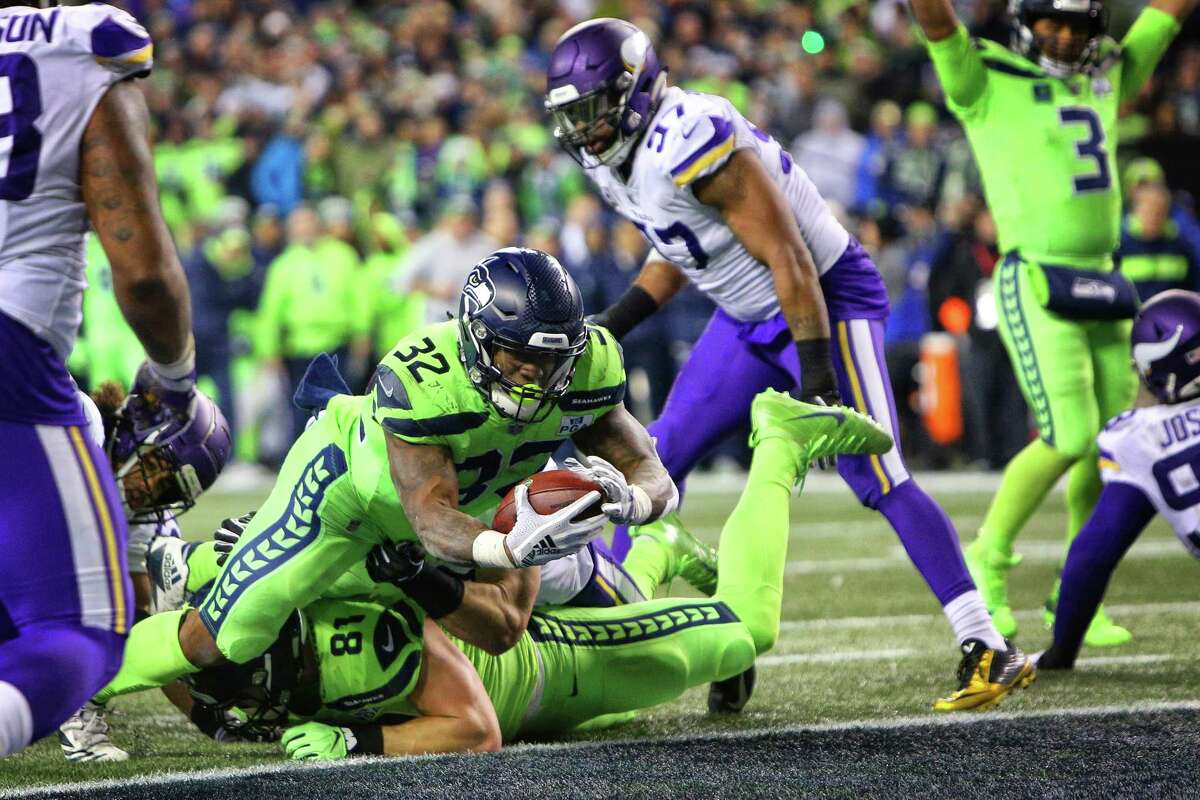 Seahawks running back Chris Carson dives for a touchdown during the second half of Seattle's game against the Minnesota Vikings at CenturyLink Field, Dec. 10, 2018.
