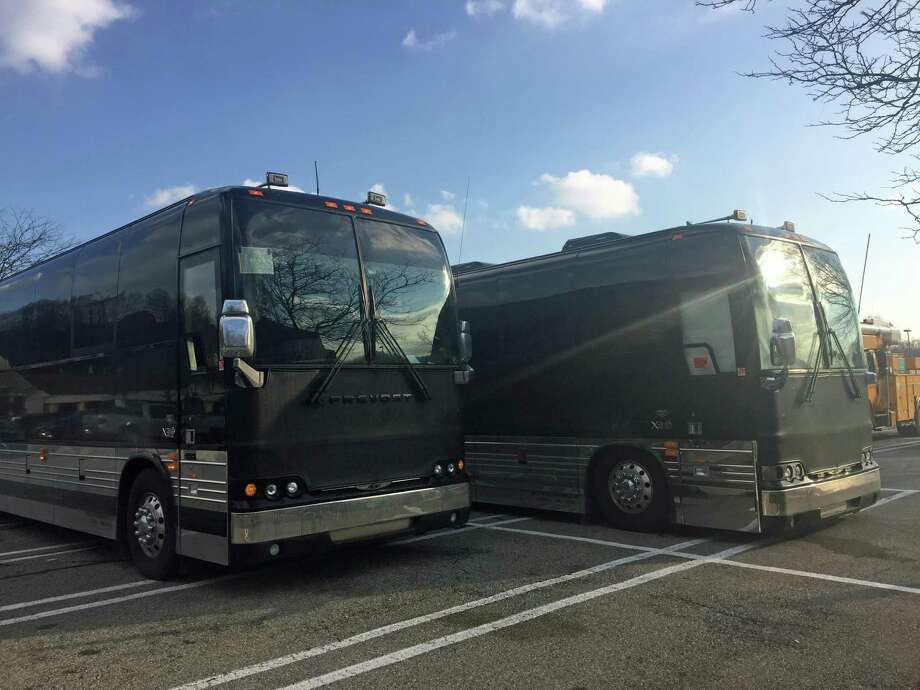 Two large couch buses with darkened windows outside Stop & Shop on Main Avenue in Norwalk turned out to be carrying the '90s boy band 98Ëš. Photo: Thane Grauel / Hearst Connecticut Media / Connecticut Post