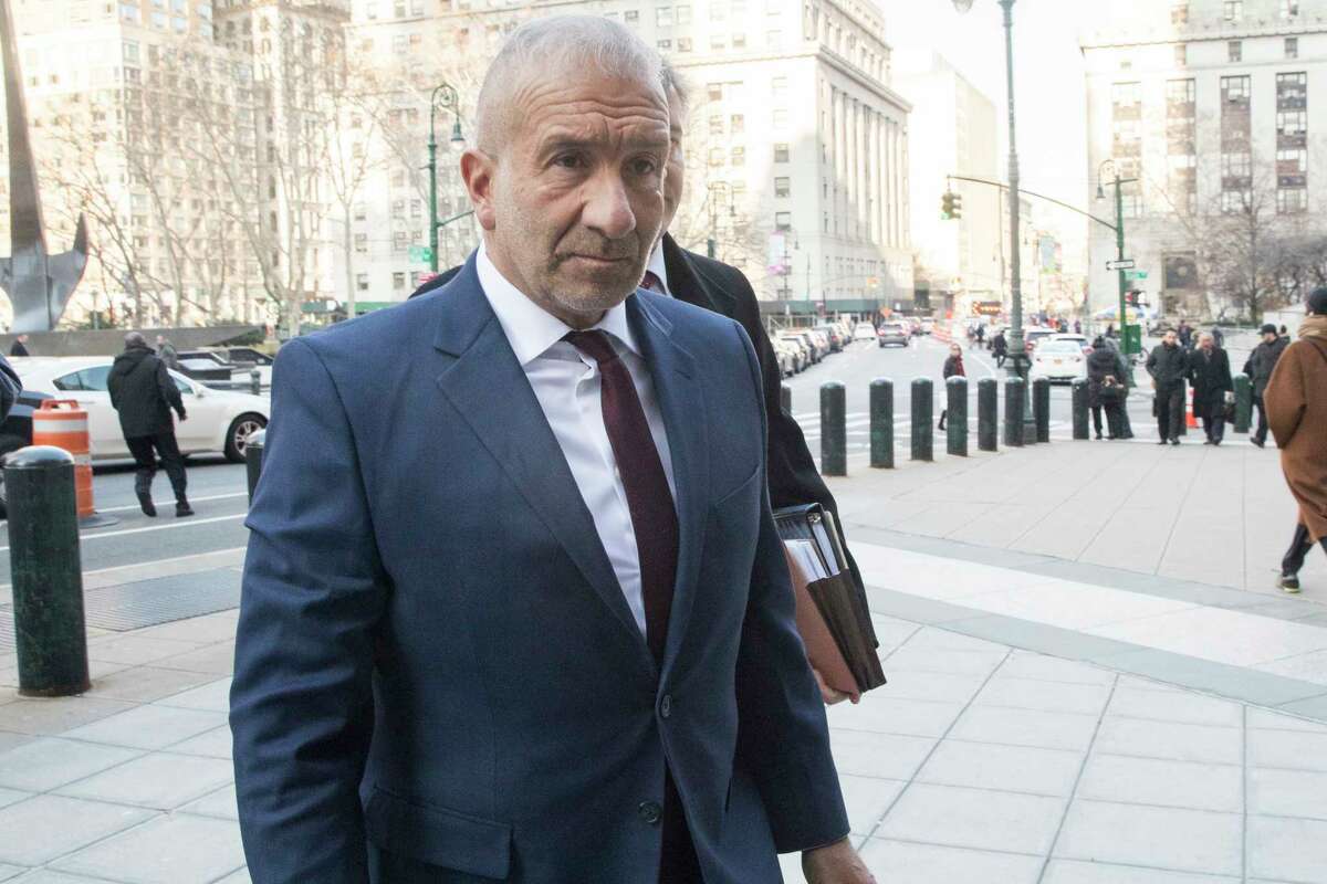 Alain Kaloyeros, the ex-president of the State University of New York's Polytechnic Institute, arrives for his sentencing at Manhattan Federal court, Tuesday, Dec. 11, 2018, in New York. Kaloyeros, who led the Polytechnic Institute until he resigned in October 2016, was convicted in July of conspiracy and wire fraud after prosecutors presented evidence that the bidding process for a state project was rigged to benefit a Buffalo developer and a Syracuse development company.