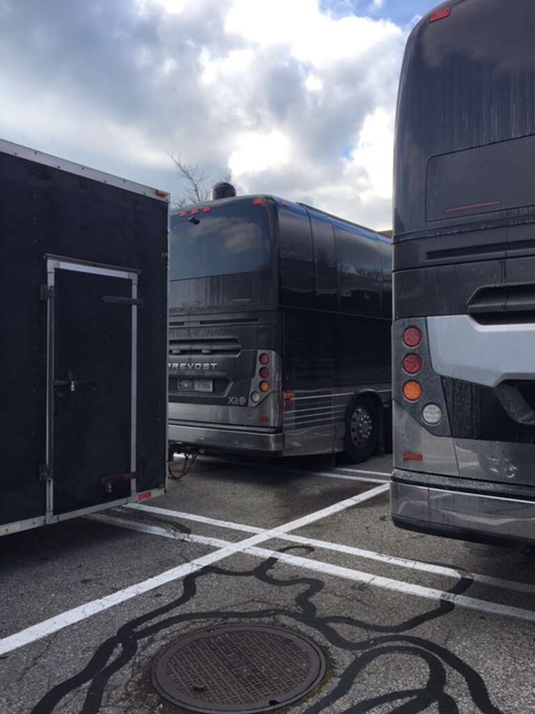 Two large couch buses with darkened windows outside Stop & Shop on Main Avenue in Norwalk turned out to be carrying the '90s boy band 98Ëš.