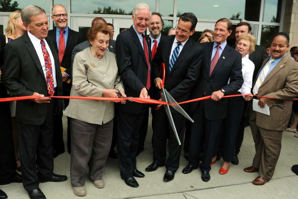 Mayor Bill Finch, Governor Dannel Mlloy and others cut the ribbon during the grand opening ceremony for the new Fairchild Wheeler Interdistrict Magnet School Campus, in Bridgeport, Conn., Aug. 19, 2013.