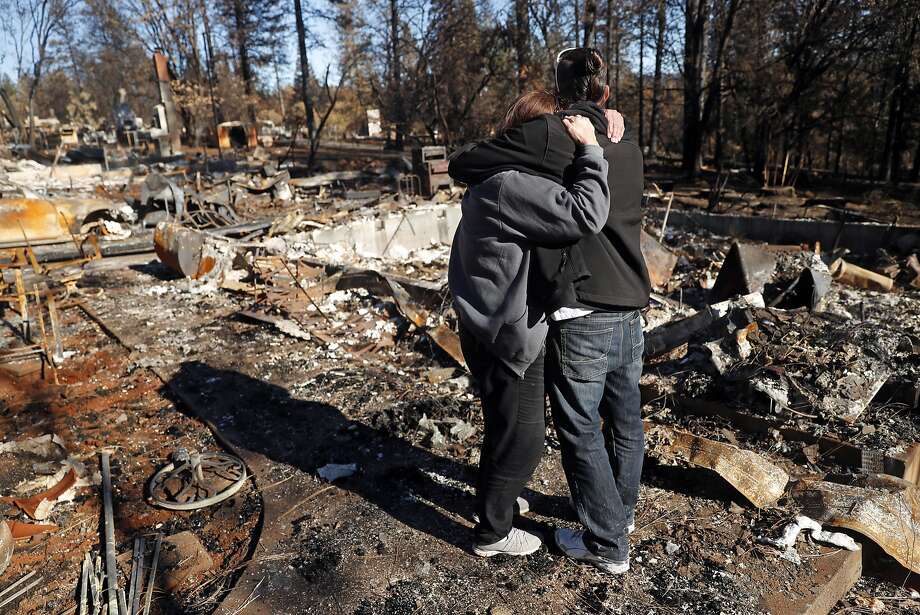 In the aftermath of the Camp Fire, Linda Haddock and her son, Jake Belculfino, embrace as they look through the remains of their house along Pentz Road in Paradise, Calif. on Thursday, December 6, 2018. Photo: Scott Strazzante / The Chronicle