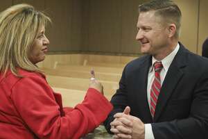 Rachel Stone talks with MPD Deputy Chief Seth Herman 12/11/18 evening at a community reception to talk with candidates for MPD chief at the Midland Municipal Courthouse. Tim Fischer/Reporter-Telegram