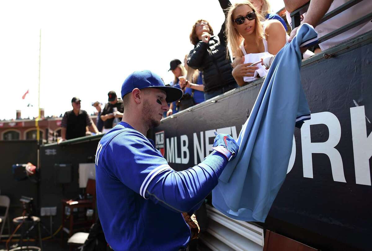Troy Tulowitzki #2 of the Toronto Blue Jays signs autographs for fans prior to the start of the game against the San Francisco Giants at AT&T Park on May 11, 2016 in San Francisco, California.