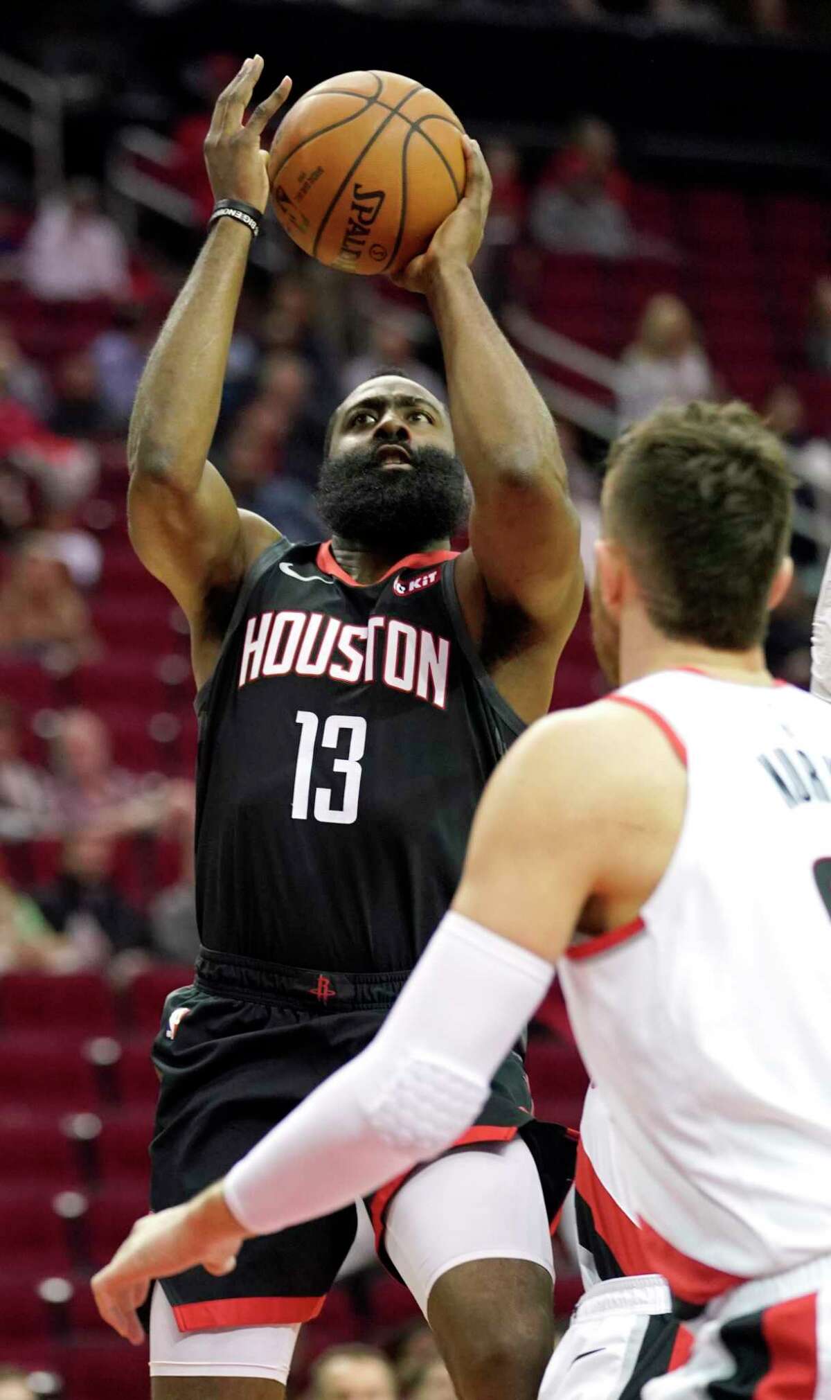 Houston Rockets' James Harden (13) shoots against the Portland Trail Blazers during the first half of an NBA basketball game Tuesday, Dec. 11, 2018, in Houston. (AP Photo/David J. Phillip)