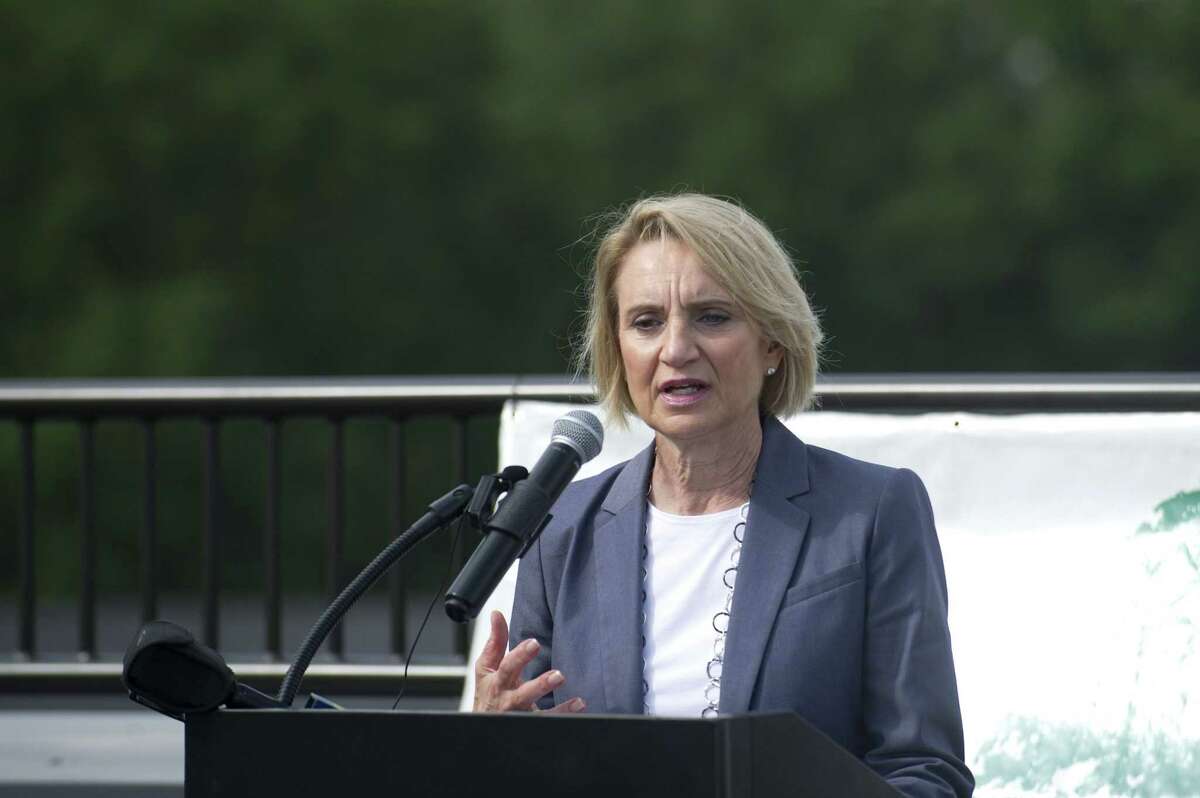 Connecticut Department of Housing commissioner Evonne Klein speaks during a formal dedication ceremony for Park 215, a mixed-use development adjacent to Leone Park, in west Stamford, Conn. on Wednesday, Oct. 10, 2018. The five-story building contains 78 one and two bedroom mixed income units and is Charter Oak Communities latest effort to revitalize the former Vidal Court housing complex.