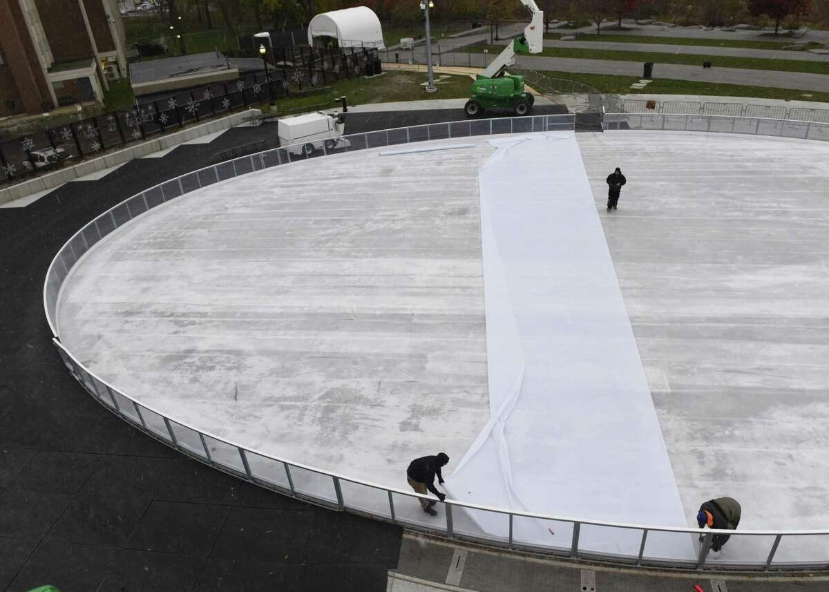Crews put finishing touches on the ice rink at Mill River Park in Stamford.
