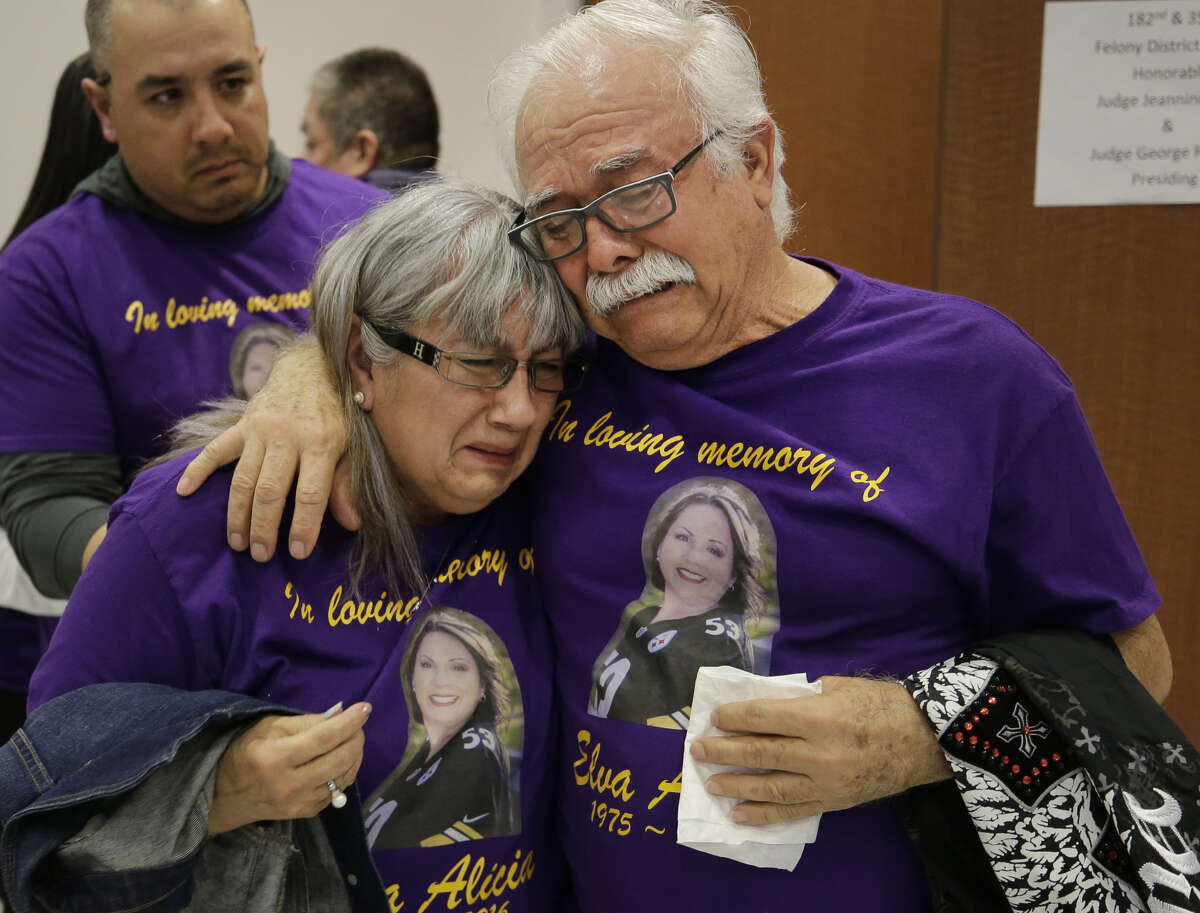 Norma Flores and her husband, Jose Flores, comfort each other as they leave from the 351st District Criminal Court Friday, Jan. 26, 2018, in Houston after the sentencing of Elrey Gonzalez, who murdered their daughter Elva Gonzalez. Elrey Gonzalez, a registered sex offender, was charged with capital murder for attempting to kidnap, then killing his estranged 41-year-old Elva Gonzalez in Baytown on October 30, 2016. Gonzalez pleaded guilty to capital murder in exchange for the state promising not to seek the death penalty.