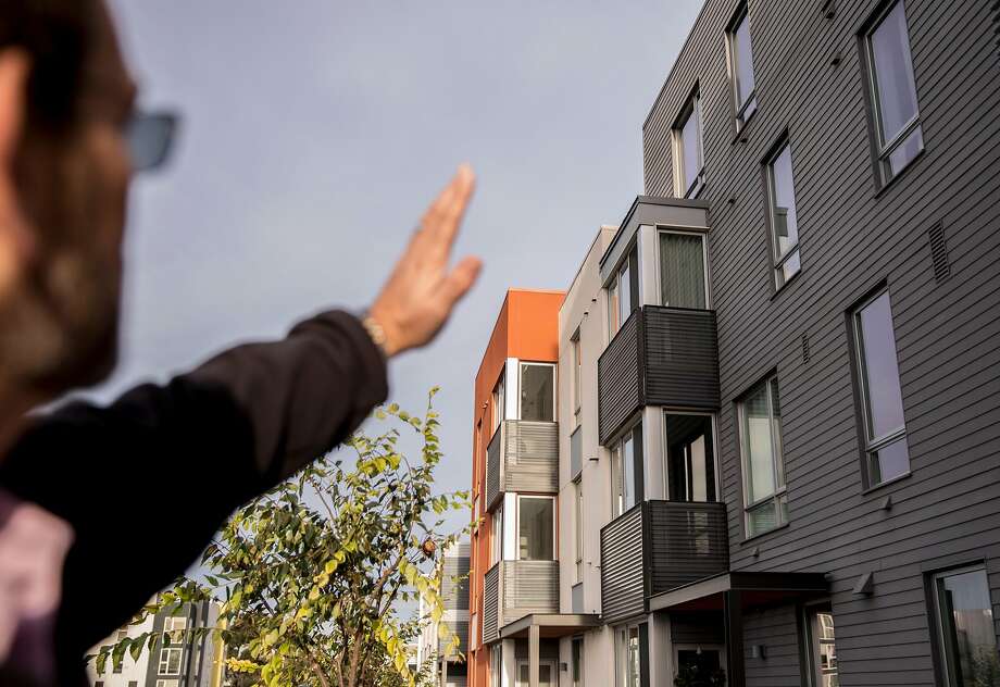 Homeowner Michael Spencer explains the layout of his building on Parcel A at the Hunters Point Naval Shipyard in the Hunters Point neighborhood of San Francisco, Calif. Wednesday, Nov. 28, 2018. Photo: Jessica Christian / The Chronicle