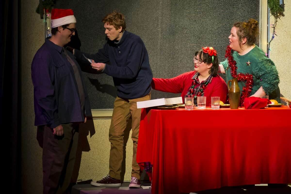 Actors act out a scene during a dress rehearsal for Center Stage Theatre's production of "A Christmas Carol" on Monday, Dec. 10, 2018 at Midland Center for the Arts. (Katy Kildee/kkildee@mdn.net)