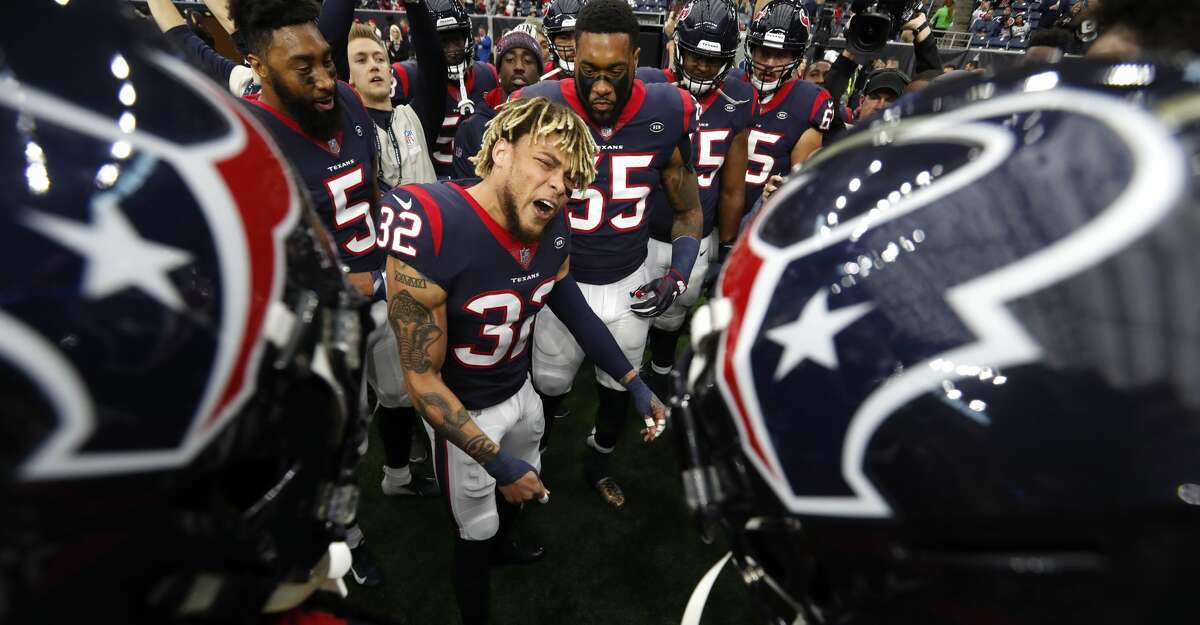 Houston Texans free safety Tyrann Mathieu (32) gathers his teammates together before an NFL football game against the Indianapolis Colts at NRG Stadium on Sunday, Dec. 9, 2018, in Houston.