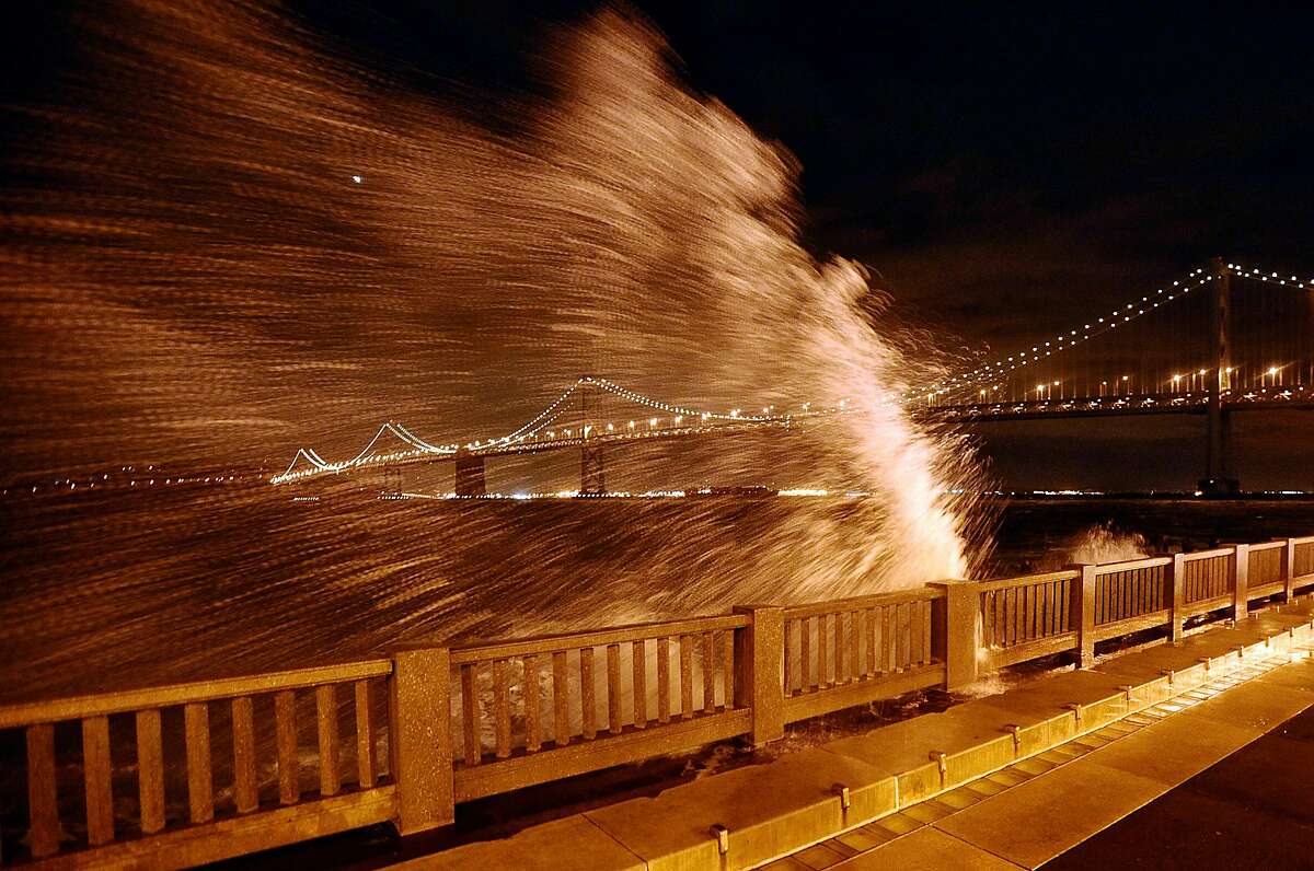 Waves break over the Embarcadero seawall near the foot of Howard Street. Photo: Noah Berger / Special To The Chronicle 2008
