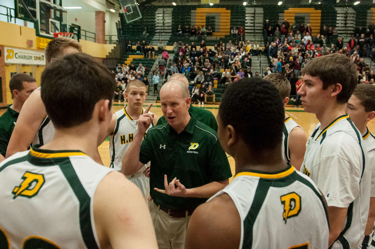 Dow High boys' basketball coach Mark Dickerson addresses his team during a game against Beaverton on Dec. 22, 2016.