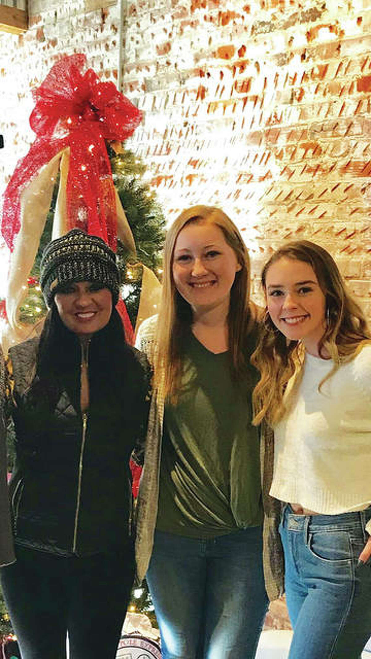 Sour Mash Boutique’s founder and reLoved Leather designer Kenneathia Hagen, with staff member Emily Whitaker and Hagen’s daughter, Kennedi Brown, who also works for the retailer.