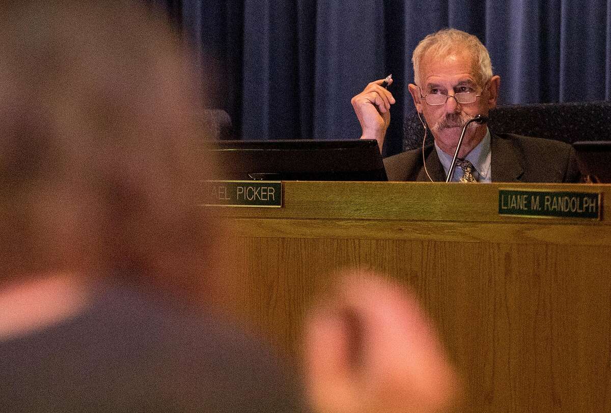 California Public Utilities Commission President Michael Picker listens during the public comment portion of a California Public Utilities Commission meeting San Francisco, Calif. Wednesday, Nov. 28, 2018 surrounding the fate of PG&E following multiple deadly wildfires.