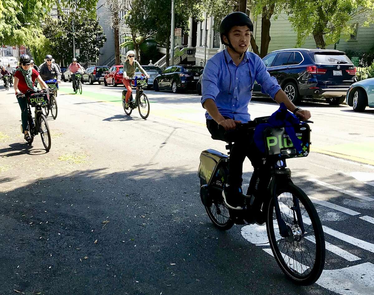 Bicyclists test new Ford GoBikes with electric pedal assist up Page Street in Hayes Valley on Tuesday