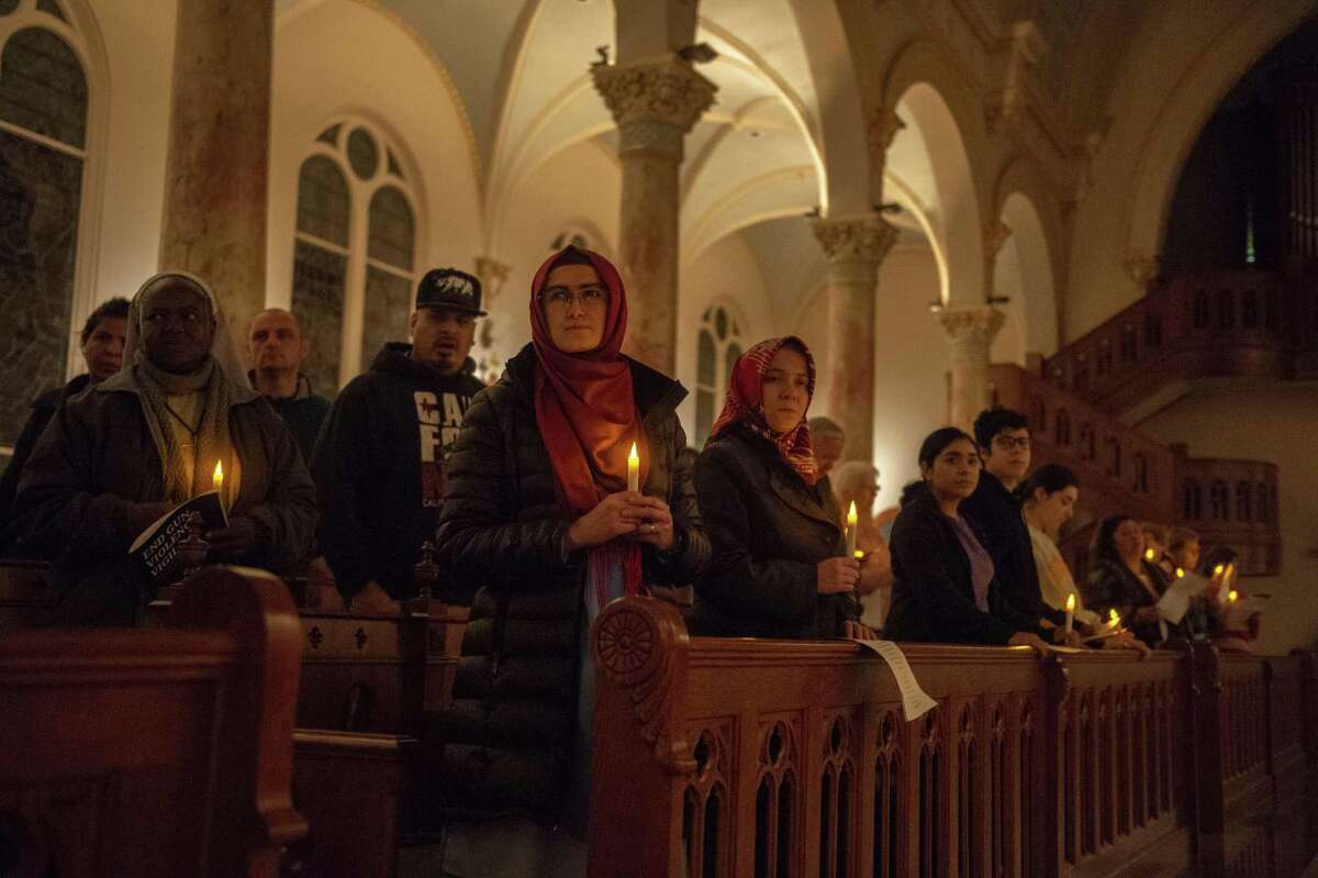 San Antonio area residents and University of the Incarnate Word attend Thursday’s vigil marking the sixth anniversary of the Sandy Hook Elementary shooting and calling for an end to gun violence.