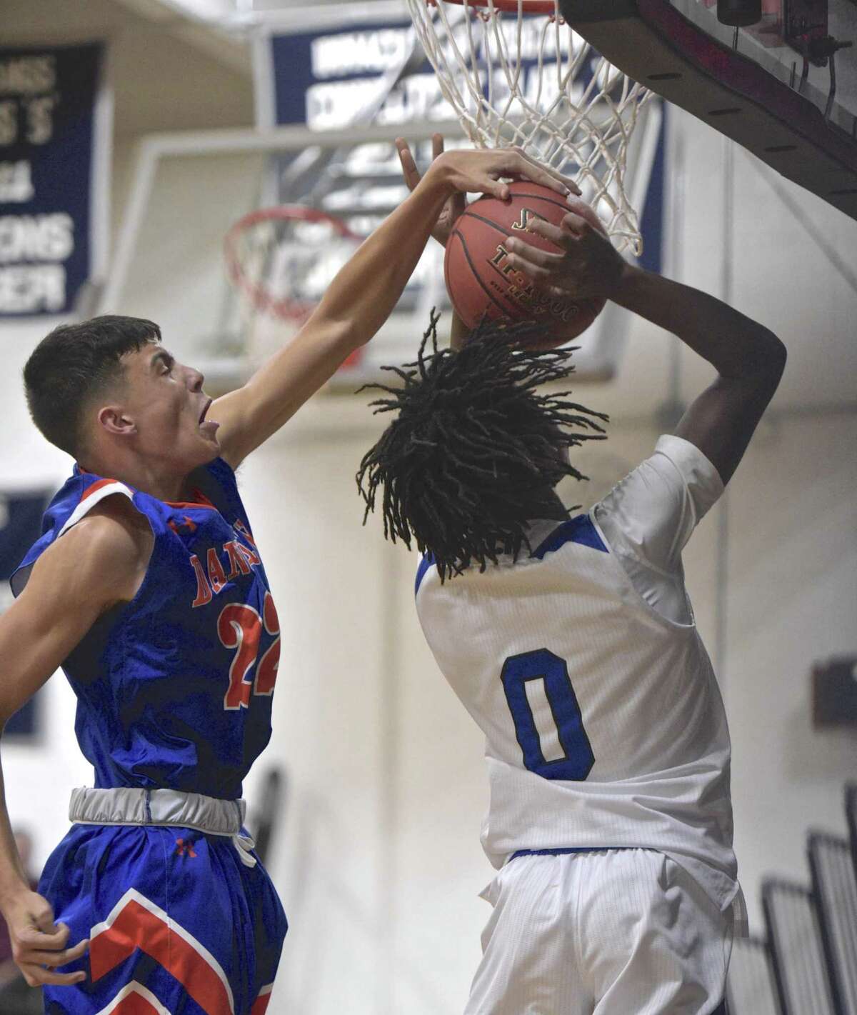 Tech's Nazeer Priar (0) has his shot blocked by Danbury's Kevin Vidmar (22) as Abbott Tech plays Danbury High School in the opening game of The News Times Tip Off Classic basketball tournament, Thursday night, December 13, 2018, at Immaculate High School, in Danbury, Conn.