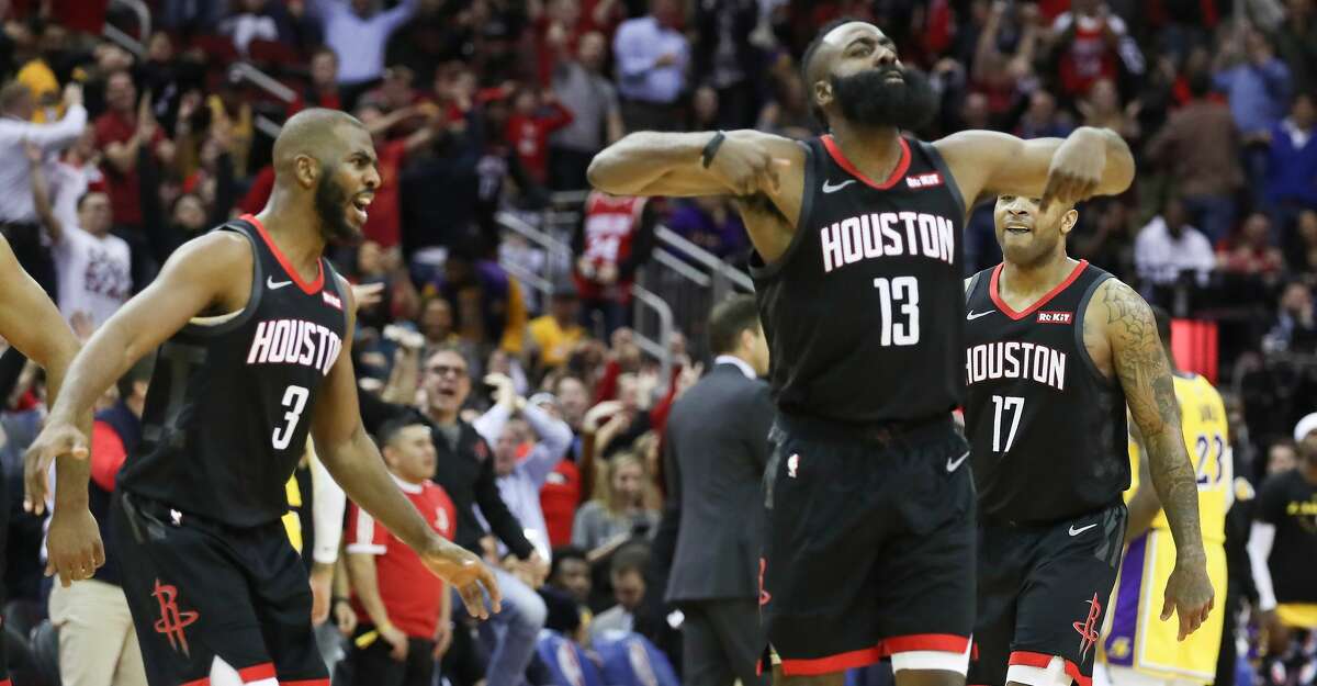 Houston Rockets guard James Harden (13) reacts to a score over Los Angeles Lakers forward LeBron James (23) that made the crowd go crazy during the second half of an NBA basketball game at Toyota Center on Thursday, Dec. 13, 2018, in Houston.