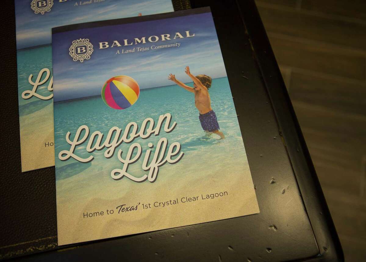 A brochure for the new lagoon amenity in the Balmoral development sits inside the front entrance to the complex in Humble, Wednesday, Nov. 28, 2018 in Houston. Some residents of Balmoral are currently banding together, worried as they find out that the lagoon amenity complex they say was promised to them as exclusive to residents, is now offering memberships to people outside of the community and selling the space as a wedding venue.