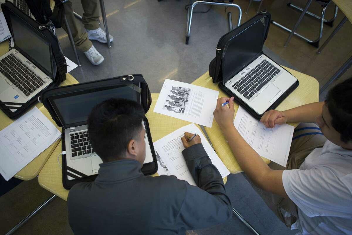 Students all use laptops in their class at Houston Independent School District's Booker T. Washington High School, Wednesday, Sept. 19, 2018 in Houston. The school opened its new building this year and is looking towards the future after experiencing failing test scores and falling enrollment over the last few years.