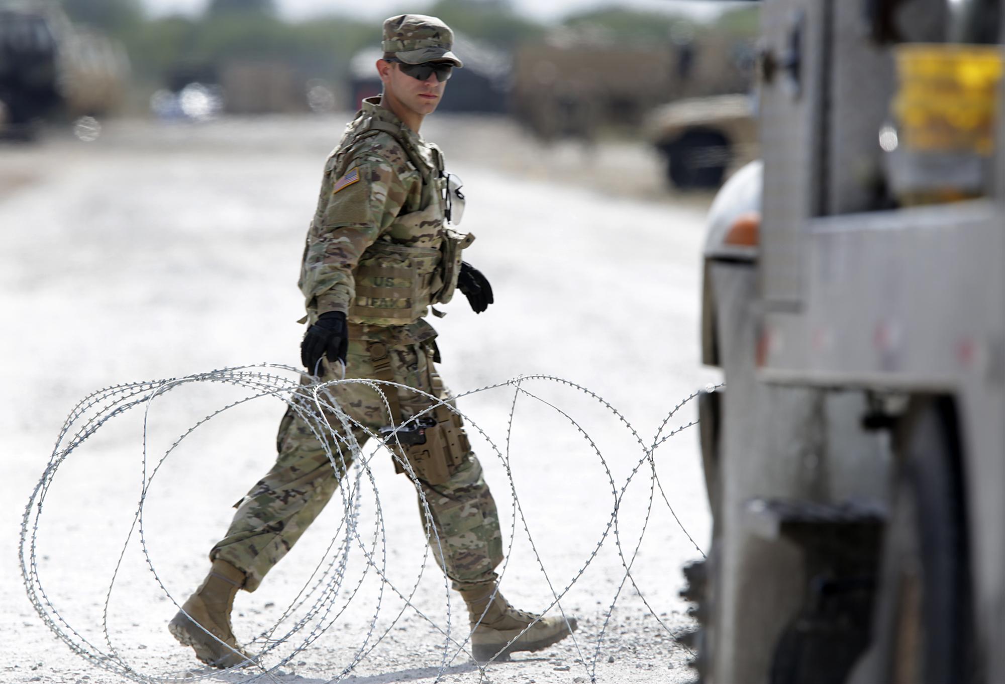 Seventy miles of razor wire later, some GI’s pulling back from border