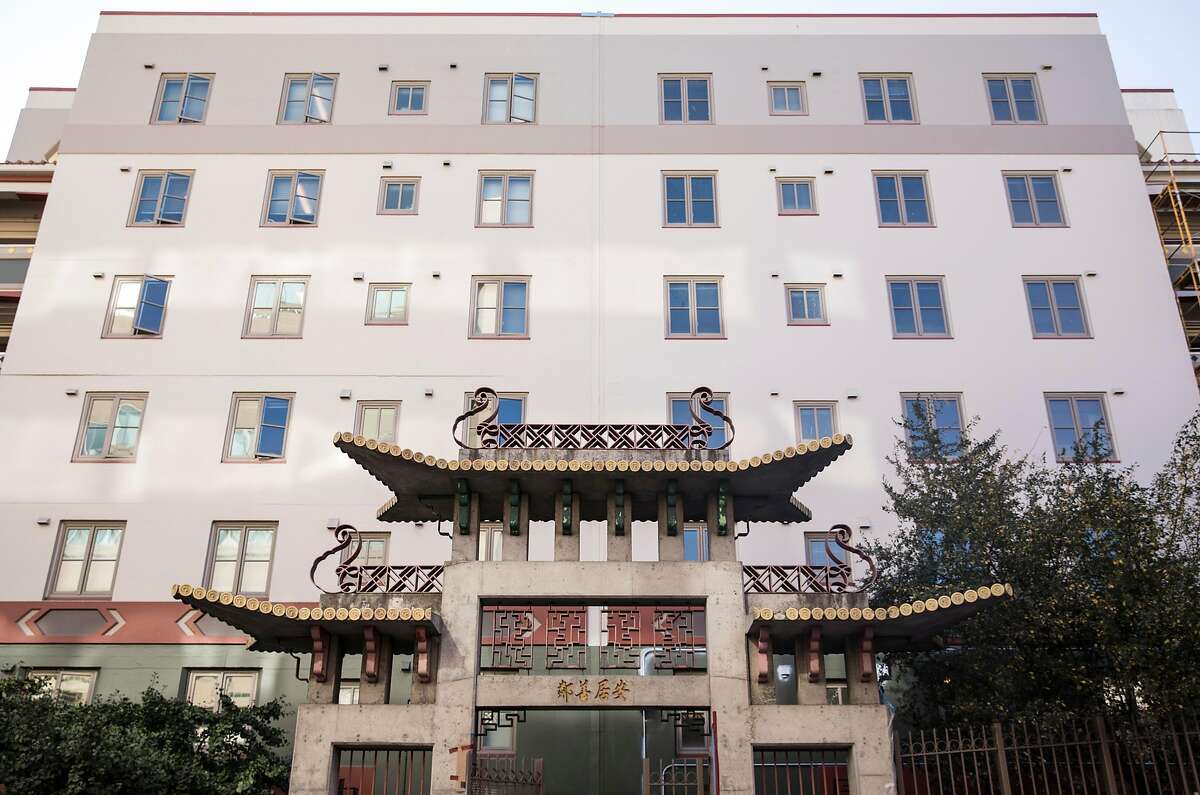 FILE-- Ping Yuen Center housing project seen on Pacific Avenue in the Chinatown neighborhood of San Francisco on Nov. 8, 2018. A man captured after a New Year’s Eve sex assault in San Francisco’s Chinatown had attacked a 99-year-old woman in her apartment at the Ping Yuen housing project, officials said Wednesday.