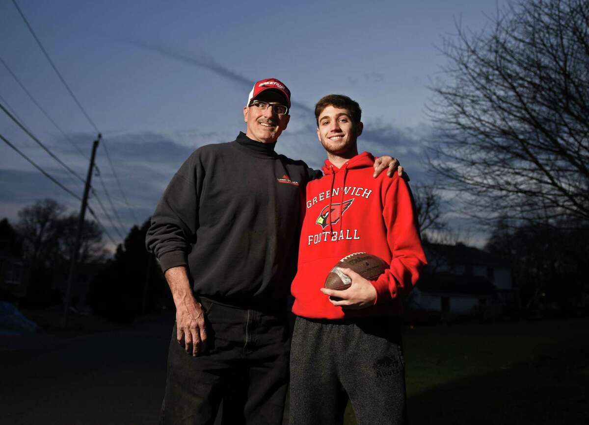 Larry DeLuca and his son, L.J. DeLuca, at their home in Cos Cob. L.J. played linebacker on Greenwich High School's 2018 undefeated team and his father Larry played defensive end on the 1983 undefeated team.