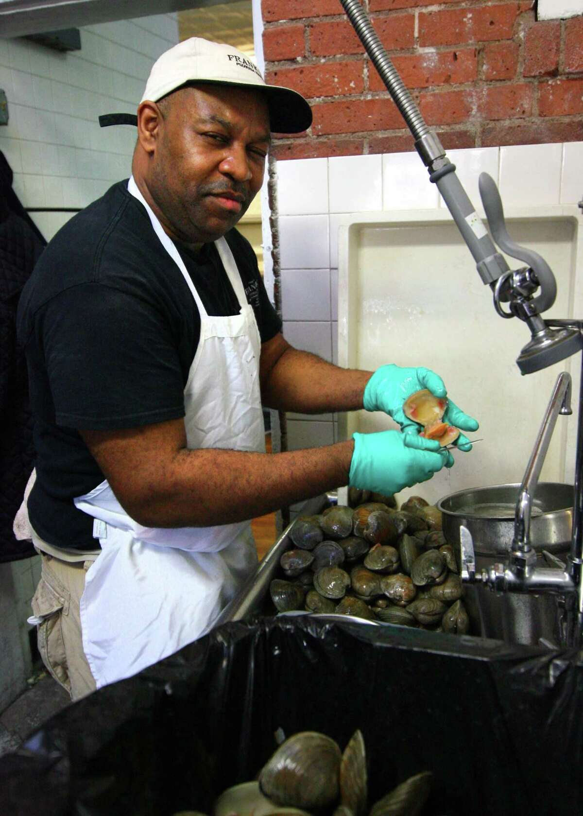 Erik Preston takes care of the clams at Frank Pepe Pizzeria Napoletana in New Haven.