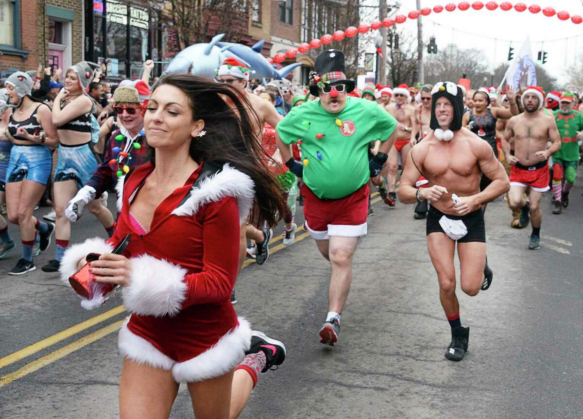 The Albany Society for the Advancement of Philanthropy hosts the 13th Annual Santa Speedo Sprint to benefit the Albany Damien Center and the HIV/AIDS program at Albany Medical Center Saturday Dec. 15, 2018 in Albany, NY. (John Carl D'Annibale/Times Union)