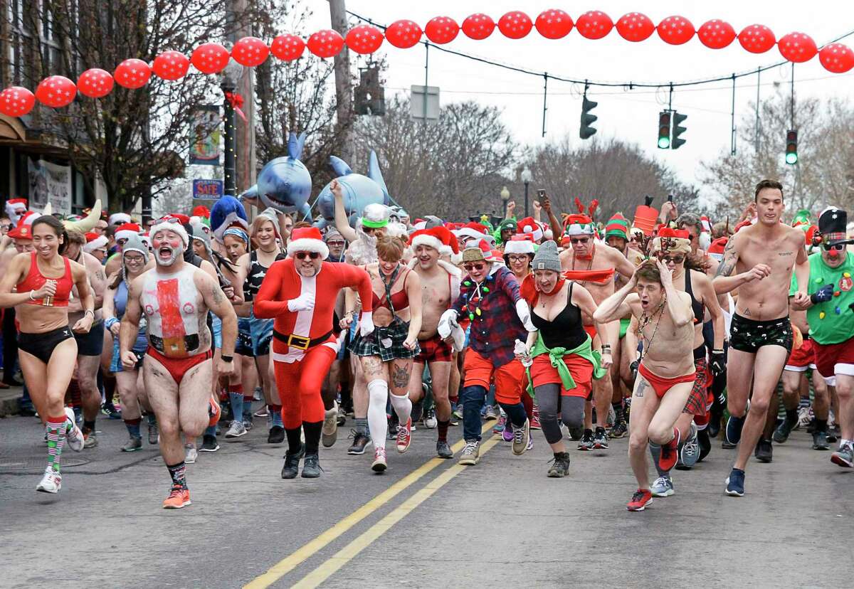 The Albany Society for the Advancement of Philanthropy hosts the 13th Annual Santa Speedo Sprint to benefit the Albany Damien Center and the HIV/AIDS program at Albany Medical Center Saturday Dec. 15, 2018 in Albany, NY. (John Carl D'Annibale/Times Union)