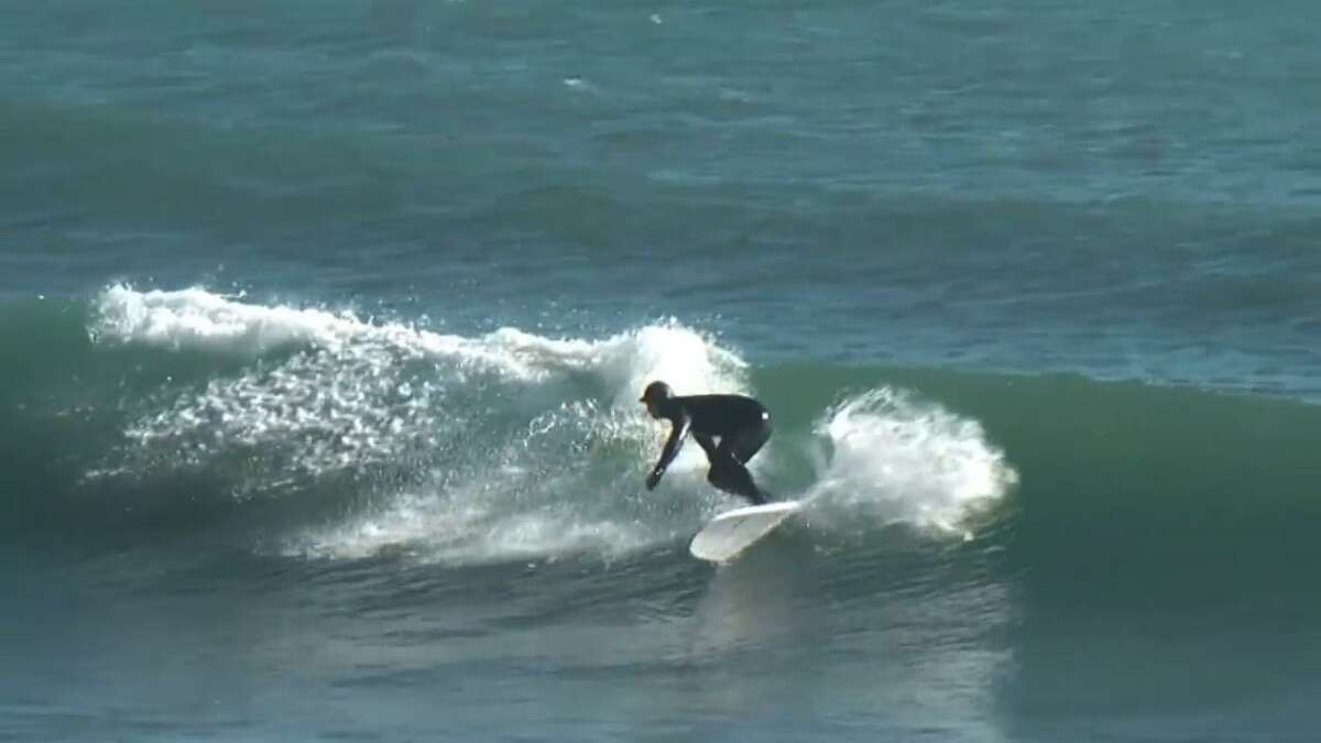 Surfing Milford priest rides the waves year round