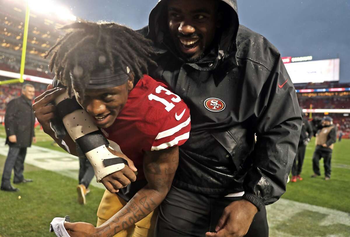 San Francisco 49ers' Richie James, Jr. gets a hug as he leaves the field after Niners' 26-23 win over Seattle Seahawks in overtime in NFL game at Levi's Stadium in Santa Clara, Calif. on Sunday, December 16, 2018.