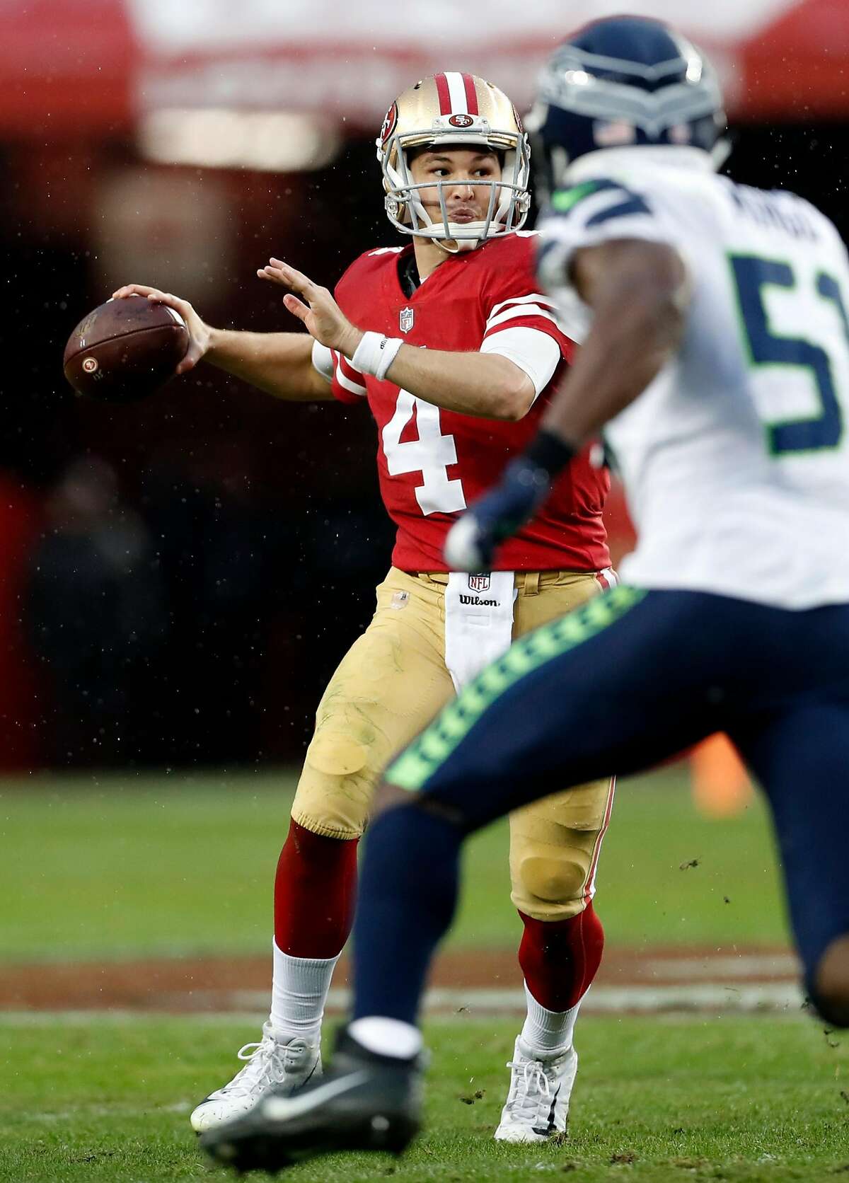 San Francisco 49ers' Nick Mullens passes against Seattle Seahawks during Niners' 26-23 win in overtime in NFL game at Levi's Stadium in Santa Clara, Calif. on Sunday, December 16, 2018.
