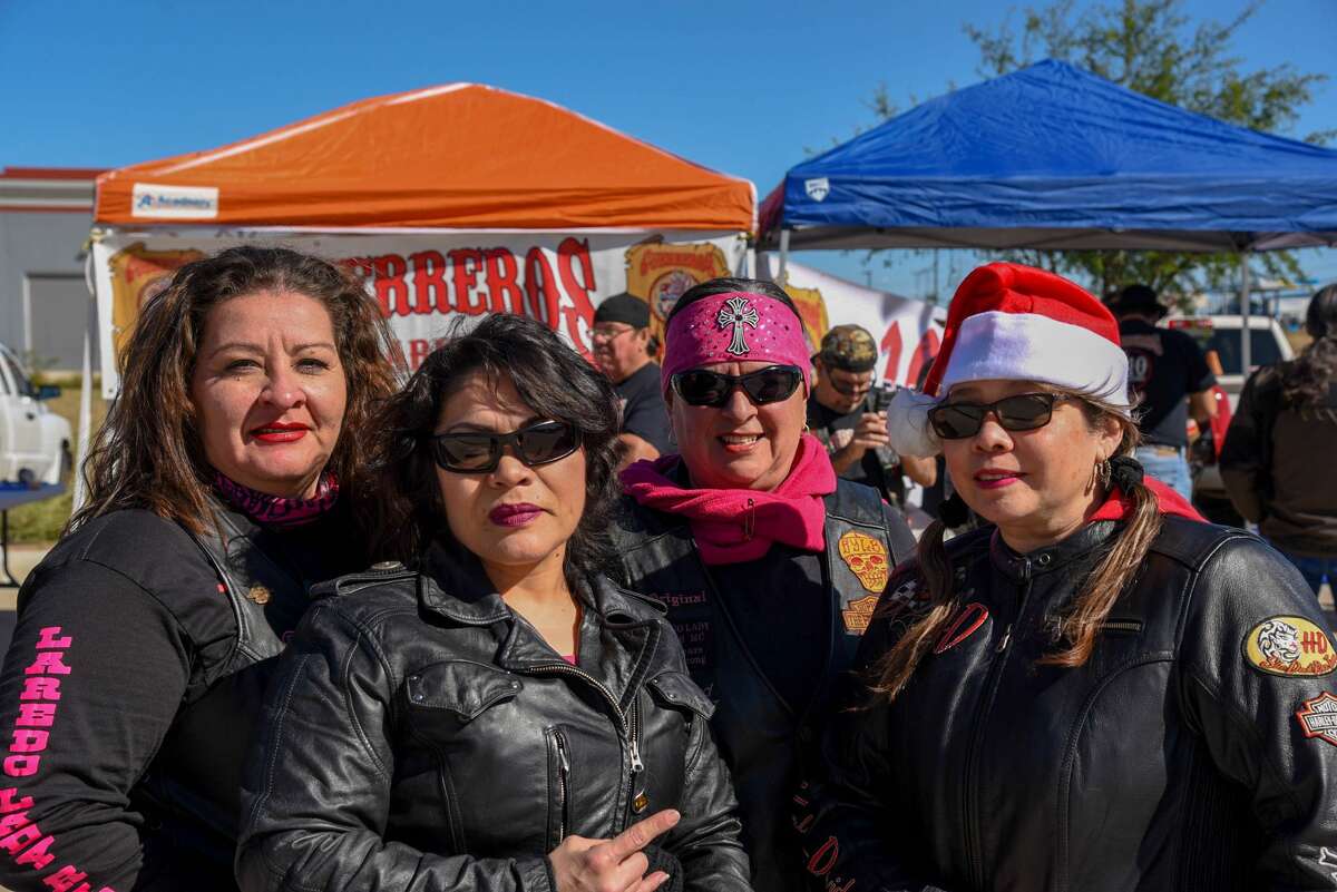 Tity, Sylvia Ruiz, Liz LIzard and Cindy Moreno pose for a photo during the Harley Davidson Christmas Party and Menudo Cook-Off.