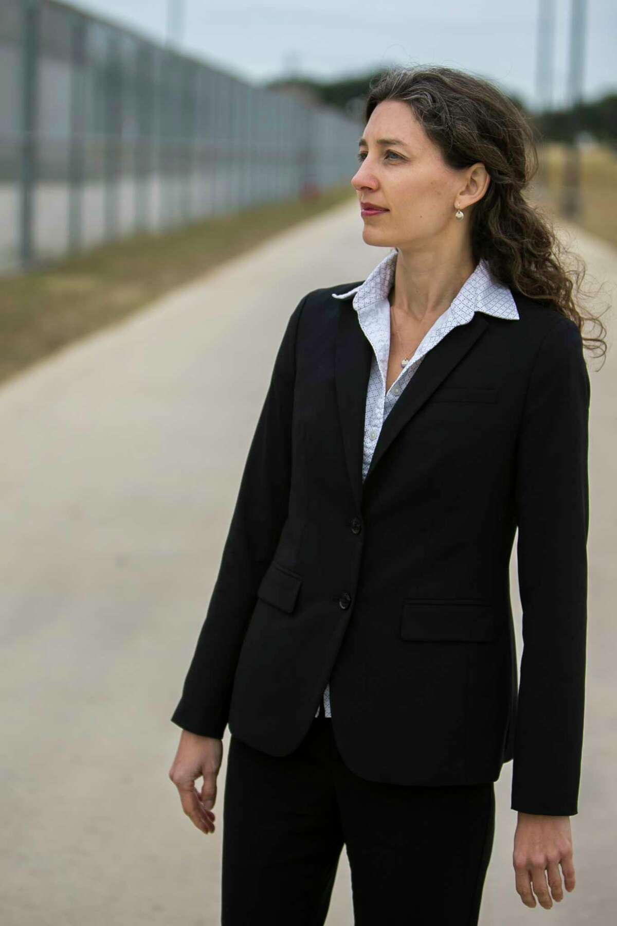 Sara Ramey, executive director of the Migrant Center for Human Rights, poses outside the South Texas Detention Complex, one of the largest detention centers in the country, where she represents clients Dec. 5, 2018. "Here in the U.S. we have a strong constitution and without education and services... people really don't have any way of effectively presenting immigration cases to judges," says Ramey of the importance of her work. People often don't realize how difficult it is for people to go through the legal process and when individuals have a lawyer their chances are increased by four times explains Ramey. "People need to have their right to due process," says Ramey.