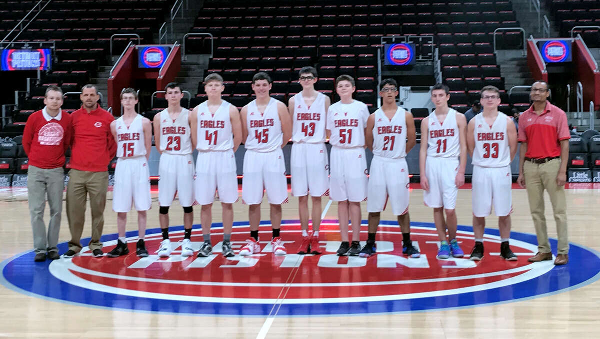 Members of the Caseville varsity basketball team pose for a picture, Saturday, at Little Caesars Arena. (Submitted Photo)