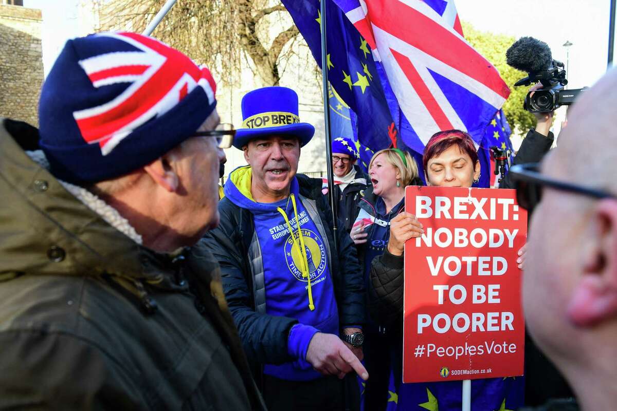 Anti-Brexit campaigners and pro-Brexit campaigners confront each other in London on Dec. 11, 2018.