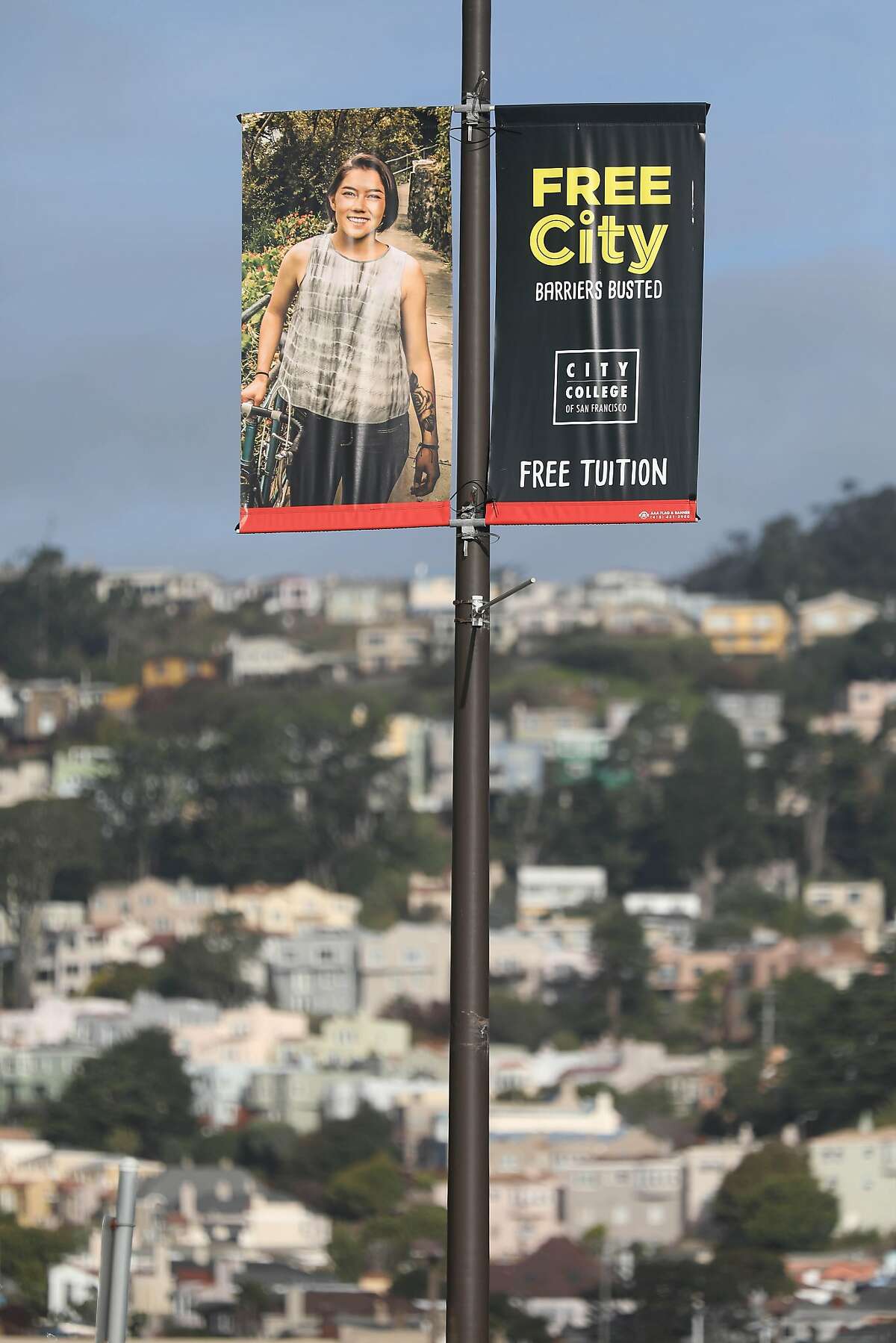 A free City College banner hangs on a light pole along Frida Kahlo Way on Tuesday, December 18, 2018 in San Francisco, Calif.