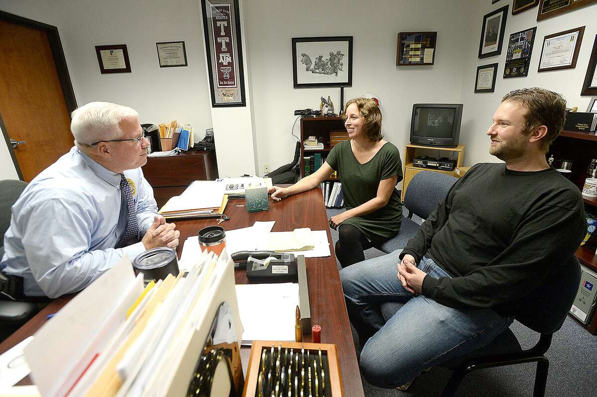 Erin Page and Sean Hill talk with Vidor Police Chief Rod Carroll in his office on Tuesday, October 23, 2018. Carroll has been re-investigating the alleged murder of Page’s mother, which inspired the film “Three Billboards Outside Ebbing, Missouri.” Kim Brent/The Enterprise