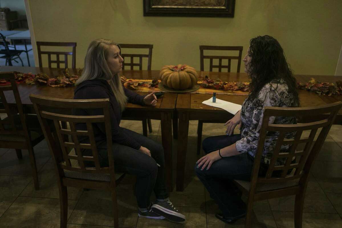 Katie Scott chats with Jennifer Woodbury who recently arrived at Grace House of San Antonio, Friday, Nov. 9, 2018. Grace House of San Antonio is a faith-based residential home for women who have been incarcerated, struggling with addiction and provides a structured environment with classes for recovery from addiction, career skills and scripture, along with daily devotionals and shared responsibilities throughout the house.