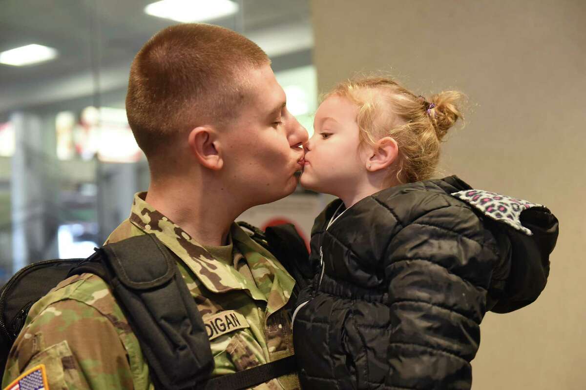 Holiday travel is getting underway early this year. Keep clicking for more photos of Christmastime in the Capital Region through the years. From the archives: Christopher Madigan kisses his niece Alexis Madigan, 2, of Melrose after arriving home at the Albany International Airport on Tuesday, Dec. 20, 2016 in Colonie, N.Y. 