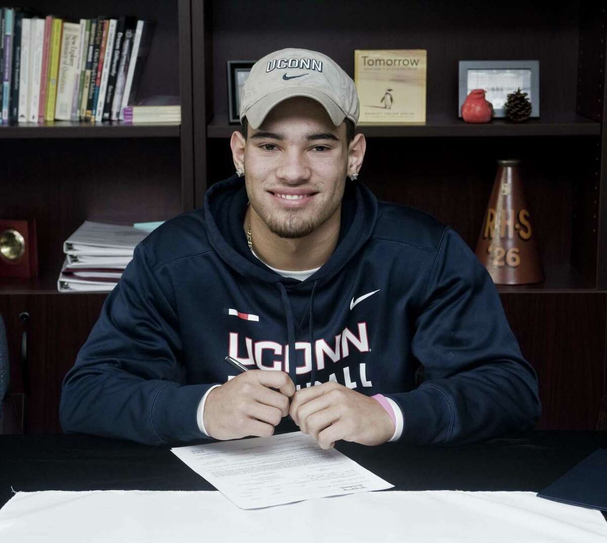 Jackson Mitchell signed a national letter of intent to play football at UConn on Wednesday at Ridgefield High School.
