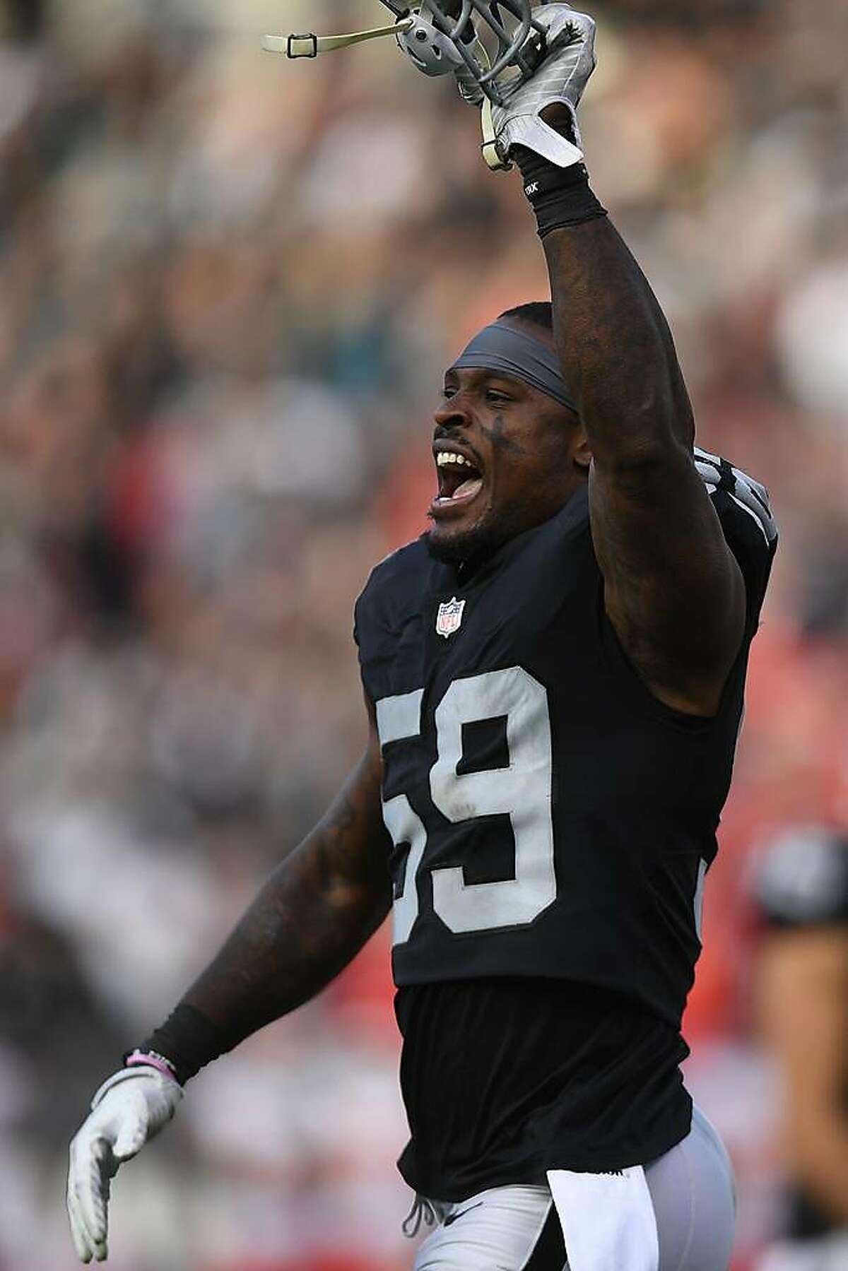 OAKLAND, CA - DECEMBER 02: Tahir Whitehead #59 of the Oakland Raiders celebrates after a play against the Kansas City Chiefs during their NFL game at Oakland-Alameda County Coliseum on December 2, 2018 in Oakland, California. (Photo by Thearon W. Henderson/Getty Images)